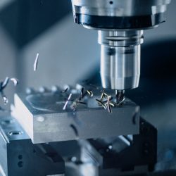 Close-up of a CNC milling machine working on metal for precise manufacturing.